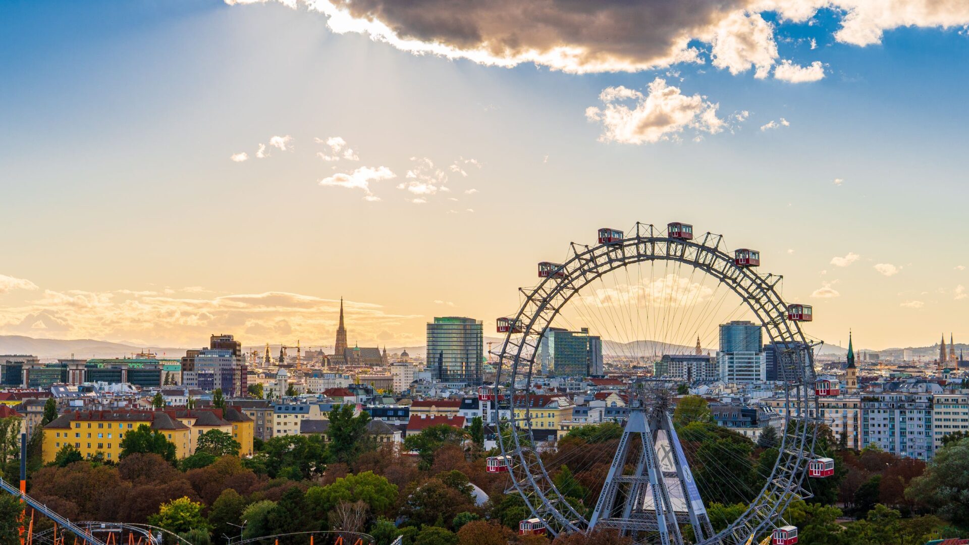 Capture of Vienna cityscape featuring the famous Ferris wheel at sunset.